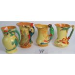 Four Burleigh jugs with themes handles: Dragon, Pied Piper of Hamlyn, Parrot & Kingfisher,