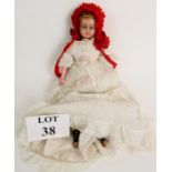 Victorian wax doll in period costume with bonnet and books, 41cm long,