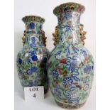 A pair of 19th century Chinese famille rose porcelain vases on celadon grounds,