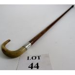 A good quality walking stick with a silver collar, 88cm tall,