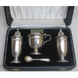 A three piece silver condiment set and m
