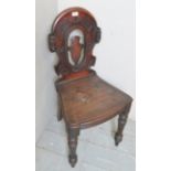 A 19th century mahogany carved hall chai