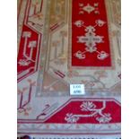 A late 20th century wool rug on cream an