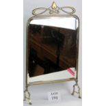 An Art Nouveau brass framed fire screen,