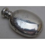 A silver smelling salts bottle with scre