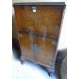 A c1930's walnut drinks/cocktail cabinet