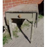 A rustic country pine drop leaf kitchen