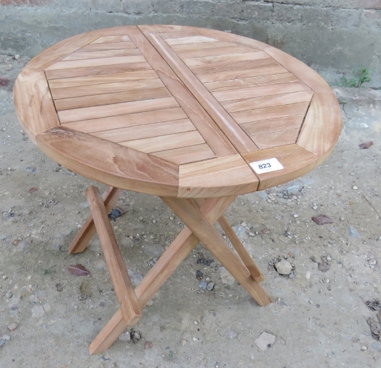 A small teak folding garden table, appro