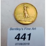 A 9ct gold golfing medallion, approx 8.7