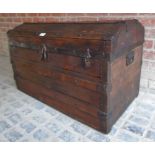 A rustic wooden dome top trunk with iron