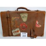 A vintage travel case with travel sticke