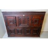 A 19th century solid oak cupboard with a