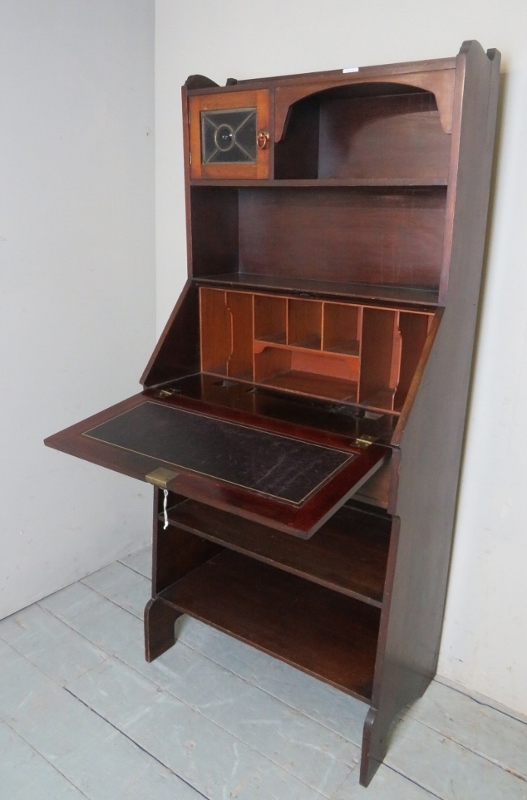 An Arts & Crafts bureau bookcase with a