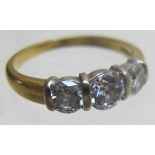 An 18ct gold three stone diamond ring, t