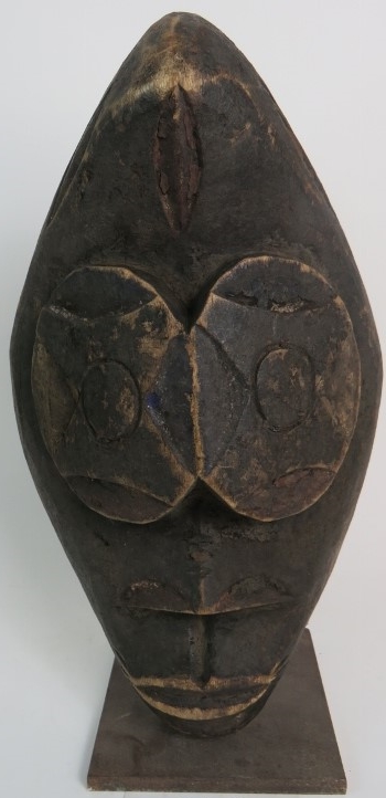 An African tribal carved wooden mask, so