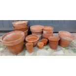 A quantity of terracotta pots various si