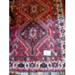 A Persian mid 20th century wool rug on c