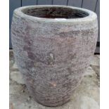 A large grey garden pot, 16" diameter es