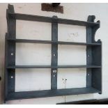 A grey painted wall hanging shelf/plate