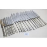 A set of twelve table knives and six mat