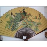 A large decorative Chinese fan, hand pai