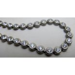 An 18ct white gold tennis bracelet set w