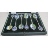 A set of six enamelled silver plated tea
