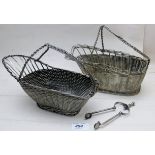 A pair of white metal basket type wine p