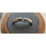 An 18ct white gold ring, with inset cent