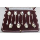 A set of eight silver coffee spoons, She