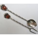 A pair of Arts & Crafts silver spoon and