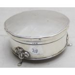 A silver trinket box on pad feet with or