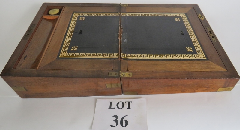 A 19th century brass bound mahogany writing slope, (slightly a/f), glass ink jar, pen tray, etc,