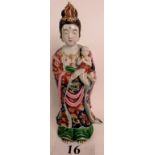 An antique Chinese porcelain figure depicting a Goddess wearing a headpiece and necklace,