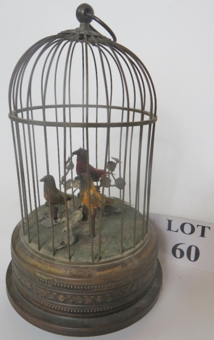 A bird cage clockwork automaton, birds sing and move, good clear sound,