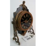 A 19th century gilt metal mounted ebonised mantel clock, with cherub surmount,