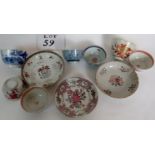 A collection of 18th century tea bowls and saucers, including an Armorial example,