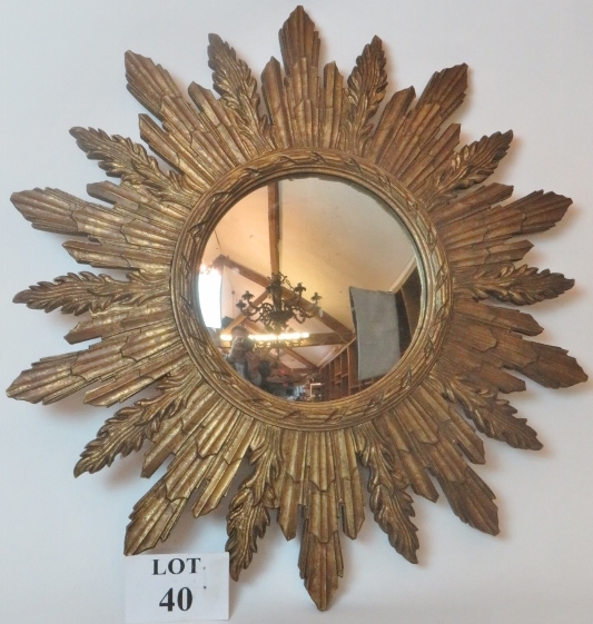 A mid-century convex star burst mirror with gilt surround,