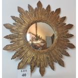 A mid-century convex star burst mirror with gilt surround,