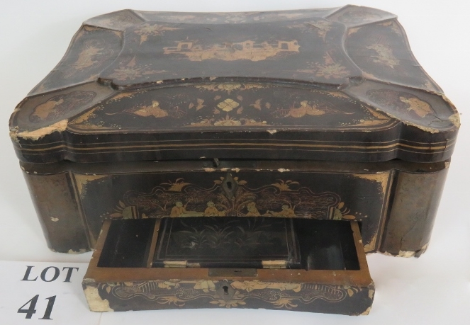 A 19th century Chinese black lacquered travelling box with lavish gilt Chinoiserie decoration and