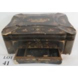 A 19th century Chinese black lacquered travelling box with lavish gilt Chinoiserie decoration and