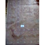A large 20th century wool carpet on coffee ground,