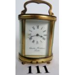 A 20th century oval gilt-brass cased carriage clock by Charles Frodsham of London, 11 cm high,