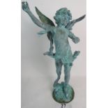 A decorative antique bronze figure of a cherub, on naturalistic base, lots of wear,