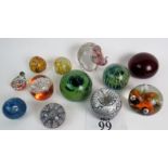 Twelve 20th century glass paperweights, including Caithness, Wedgwood, Mdina,