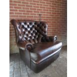 A large 20th Century brown leather Chesterfield armchair in very good condition est: £300-£500