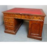 A Victorian walnut Partner's Desk of desirable proportions with a burgundy leather top,