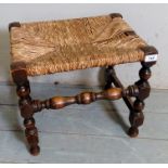 A small rush seated bobbin turned footstool,