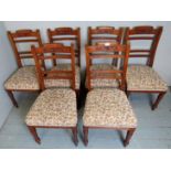 A set of 6 19th century dining chairs upholstered in a floral material and terminating on turned