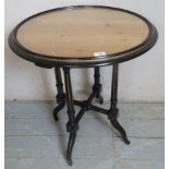 A Victorian ebonised circular occasional table,